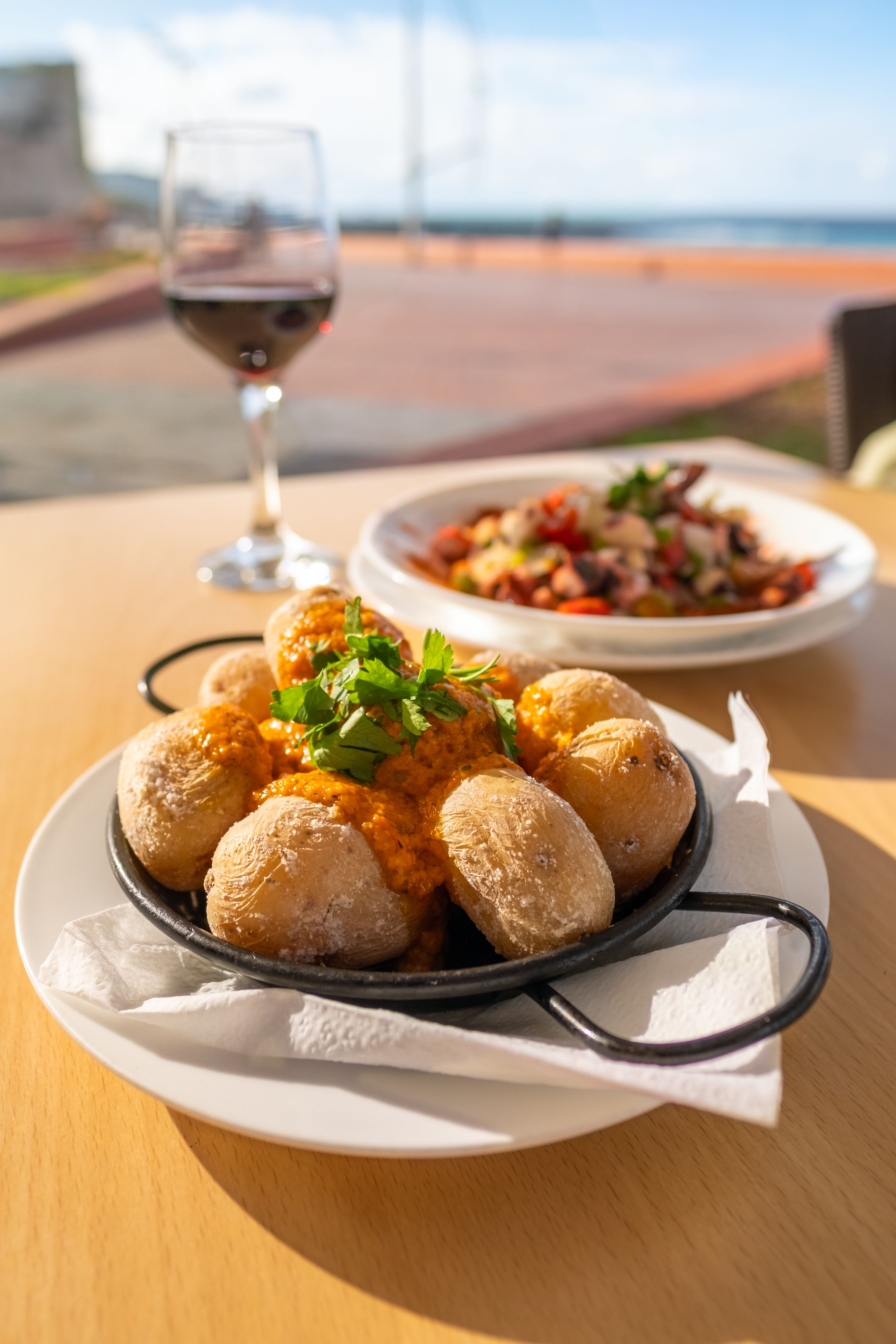 Papas Arrugadas — salty, wrinkled Canary Islands potatoes served with fiery mojo picón.   