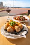 Papas Arrugadas — salty, wrinkled Canary Islands potatoes served with fiery mojo picón.