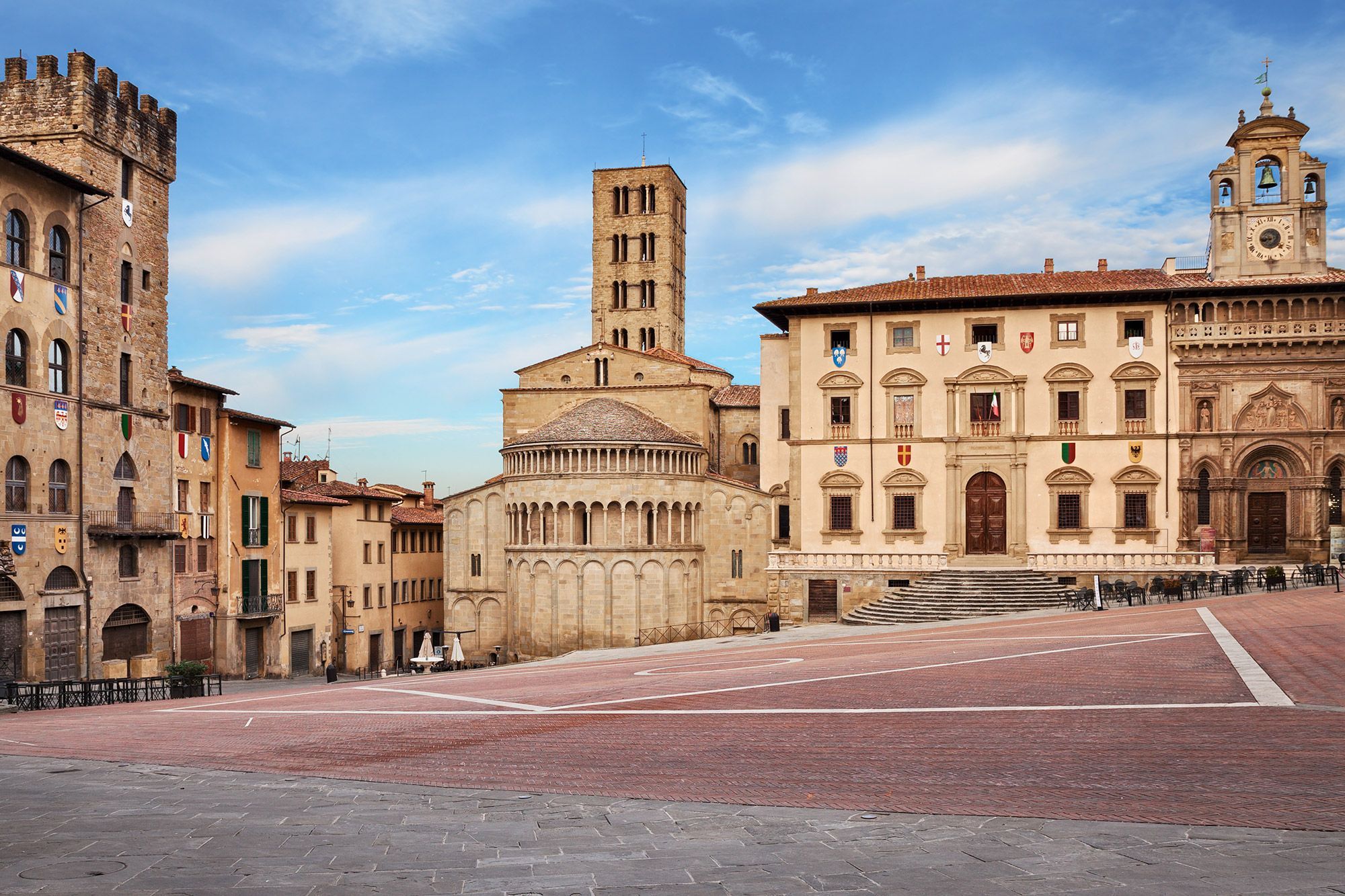 The main square Piazza Grande with the medieval church and buildings in Arezzo, Italy.