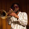 Musician Maurice “Mobetta” Brown plays the trumpet