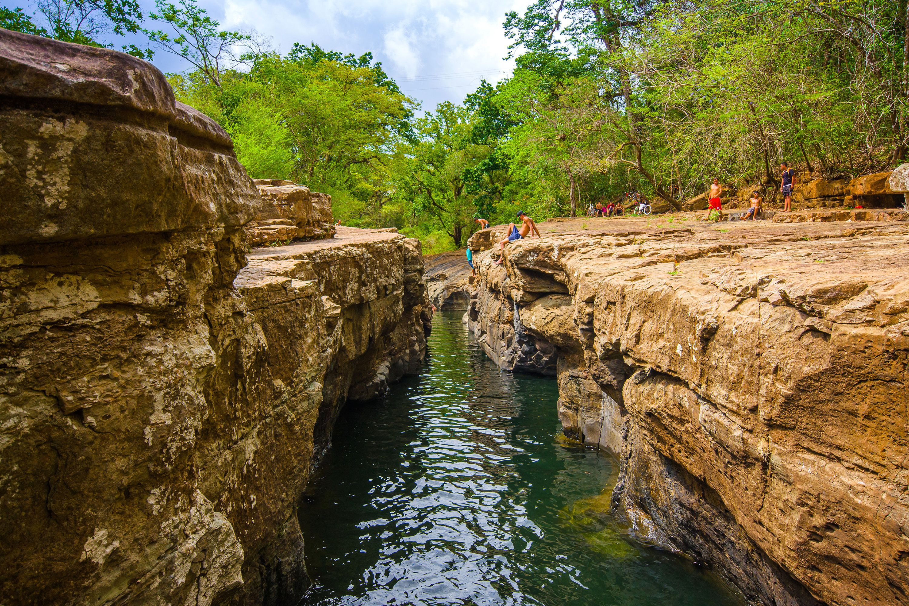 Water flows between two rocky cliff areas.