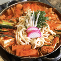 A metal pan full of noodles, vegetables and meat at Chosun Galbee in Koreatown, Los Angeles