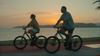 Chef José Olmedo Carles Rojas and his wife Chevy Tyler ride bikes along the Amador Causeway at sunset in Panama City