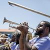 A brass band standing in a row play their instruments in New Orleans, Louisiana