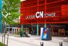 Visitors gather outside the bright red entrance of Toronto’s iconic CN Tower