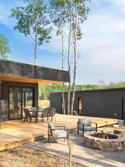 A modern Vrbo with a deck and firepit