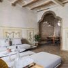Modern comfort meets historical details such as a vaulted ceiling and ornate doorway