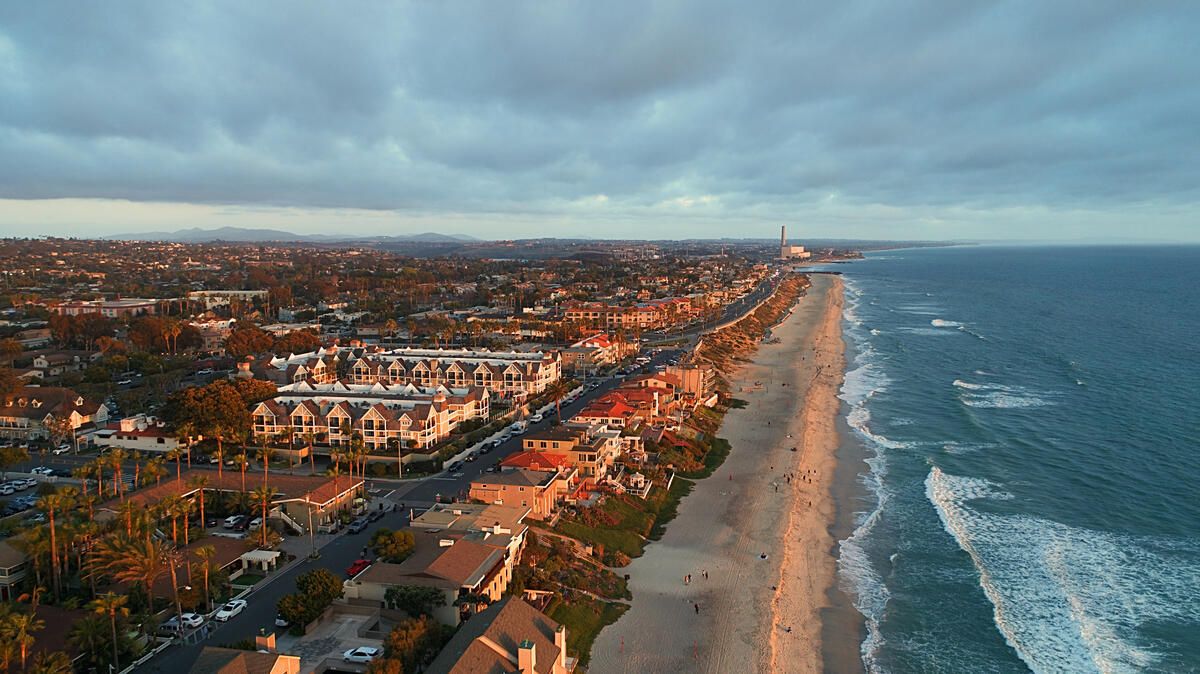 Birds-eye view of Carlsbad, California wide beach at sunseet. 