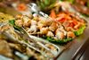 Seafood buffet display with shells, oysters, and shrimp