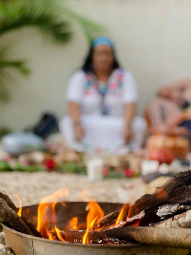 A fire burns as part of a traditional ceremony in Tulum, Mexico