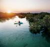 Kayaking into the sunset at Jubail Mangrove Park
