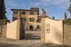 An exterior gate leading to the entrance of Art Hotel Villa Agape in Florence