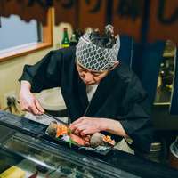 A sushi chef hard at work in Tokyo, Japan