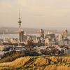 Auckland's Sky Tower dominates the skyline, as seen from grassy Mount Eden