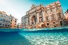 A view of the coins in the water with the Trevi Fountain in the background in Rome, Italy.