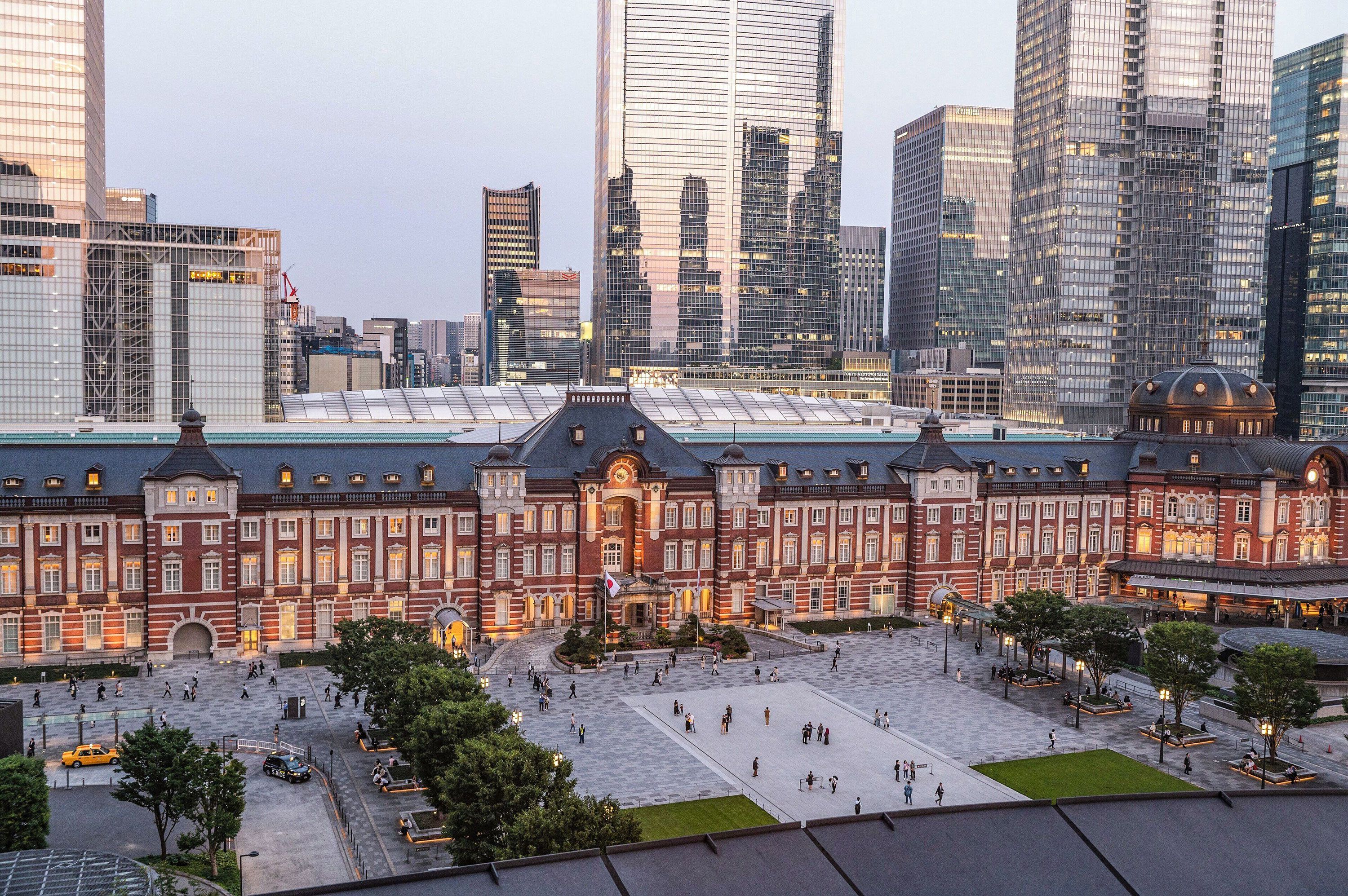 The Tokyo Station Hotel, surrounded by tall skyscrapers.