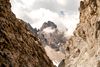 Clouds scatter among mountain peaks.