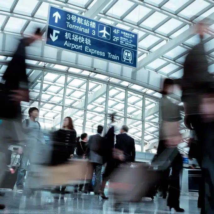 Lots of people in motion in Beijing airport