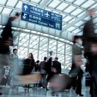 Lots of people in motion in Beijing airport