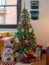 A Christmas tree decorated with colorful baubles