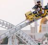 People ride a rollercoaster at Yas Island, Abu Dhabi