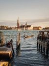 Venice's always picturesque waters and skyline seen from a jetty