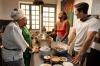 Antoni Porowski with Issa Rae, helping to prepare a traditional Senegalese dish. Photo: National Geographic/John Wendle