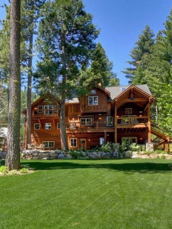 A three story wooden cabin Vrbo set in its own garden in Lake Tahoe