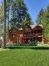 A three story wooden cabin Vrbo set in its own garden in Lake Tahoe
