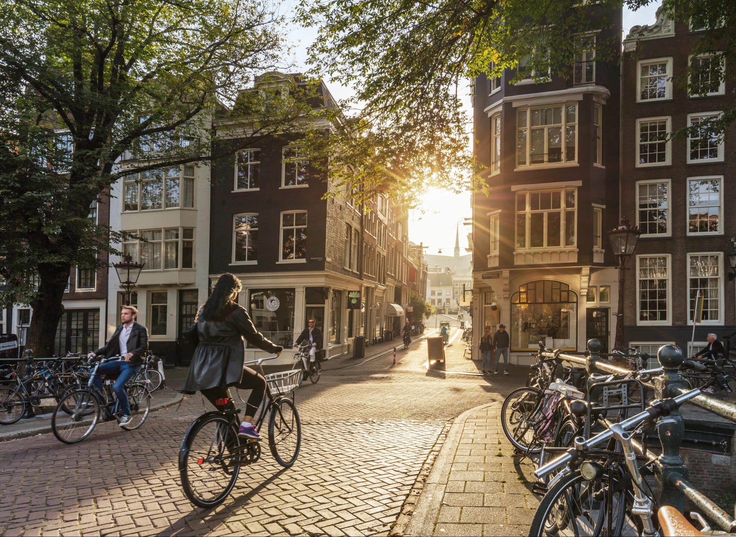 A cyclist crosses a bridge in Amsterdam