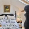 A bed in a Vrbo with pretty monochrome pillows