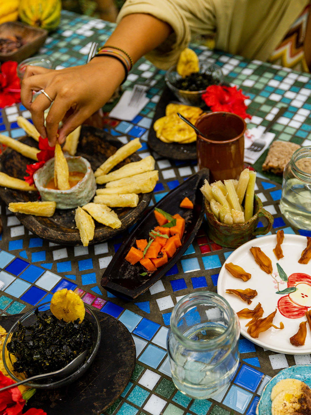 A table filled with small plates of Panamanian food