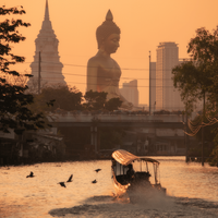 The giant Buddha statue of Wat Paknam Phasi Charoen temple in Bangkok, seen from the water