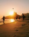 A group of people playing football on Ipanema beach, Rio de Janeiro