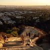 View of Los Angeles and people hiking up Runyon Canyon Trail