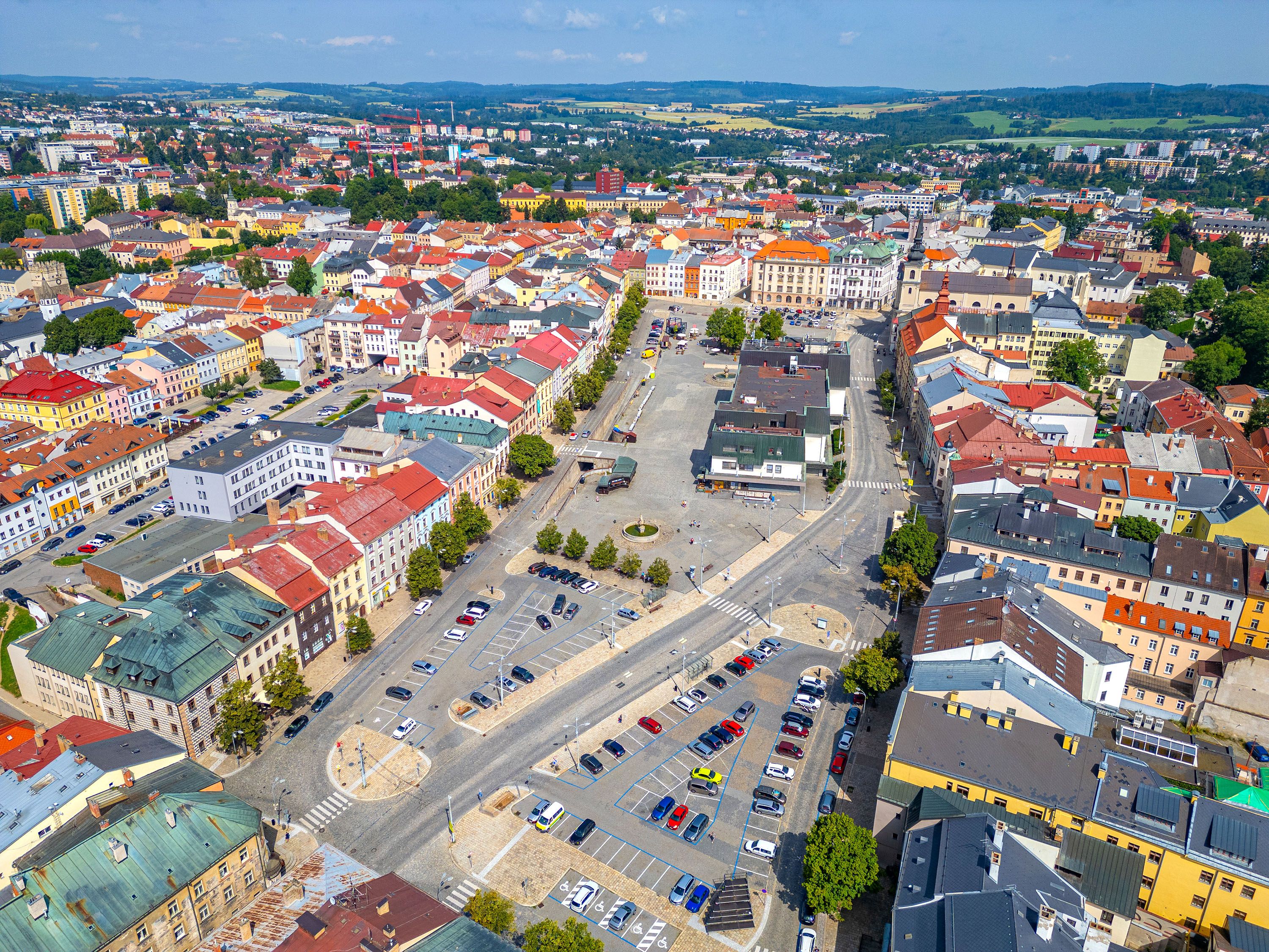 Aerial view of rooftops and a city center.