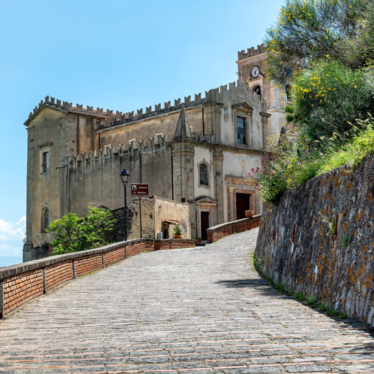 A steep road leads into the village of Savoca, Sicily