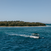 A boat sails away from the shore in Punta Cana, Dominican Republic