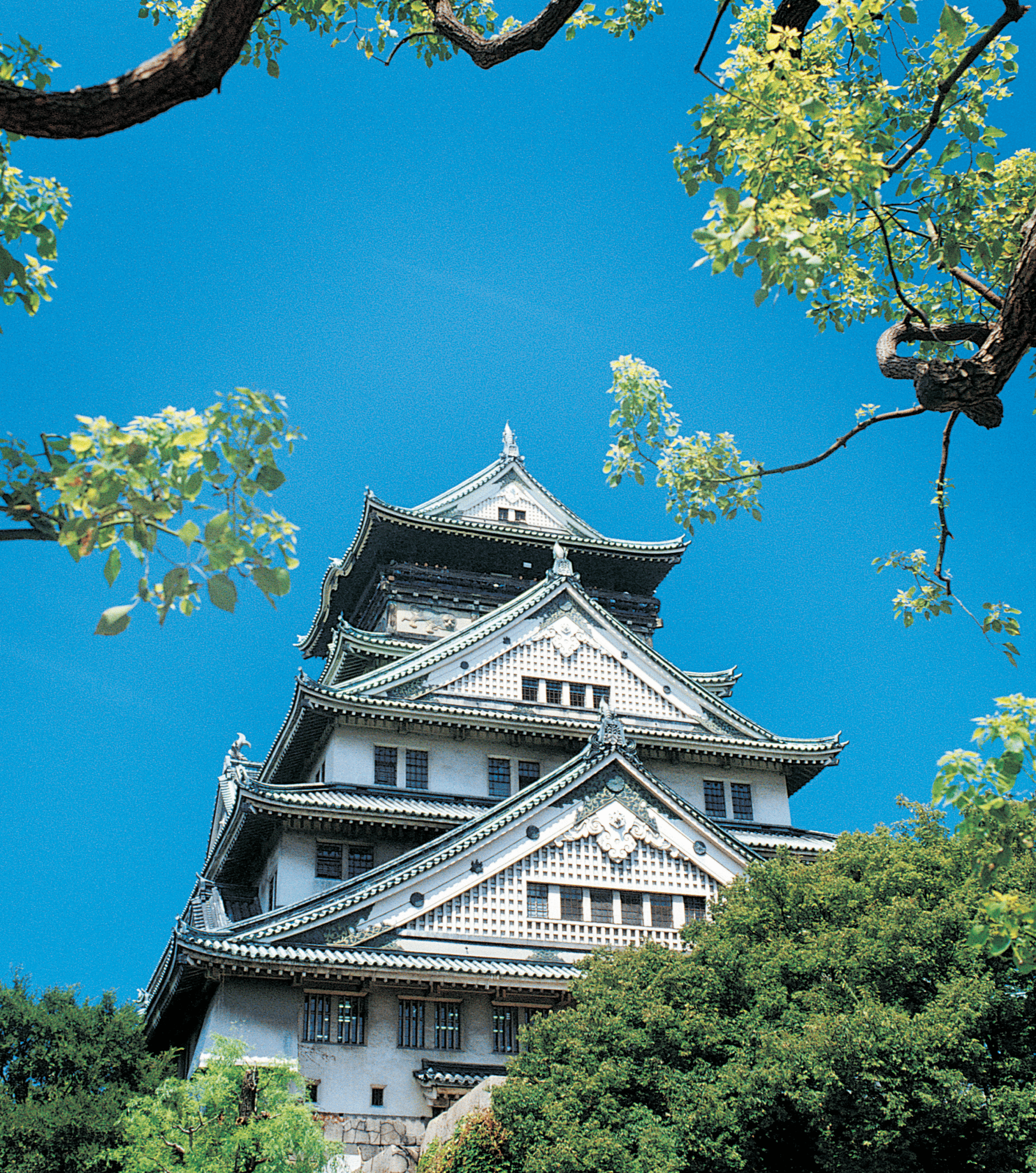 The 16th century Osaka Castle, seen against a bright blue sky