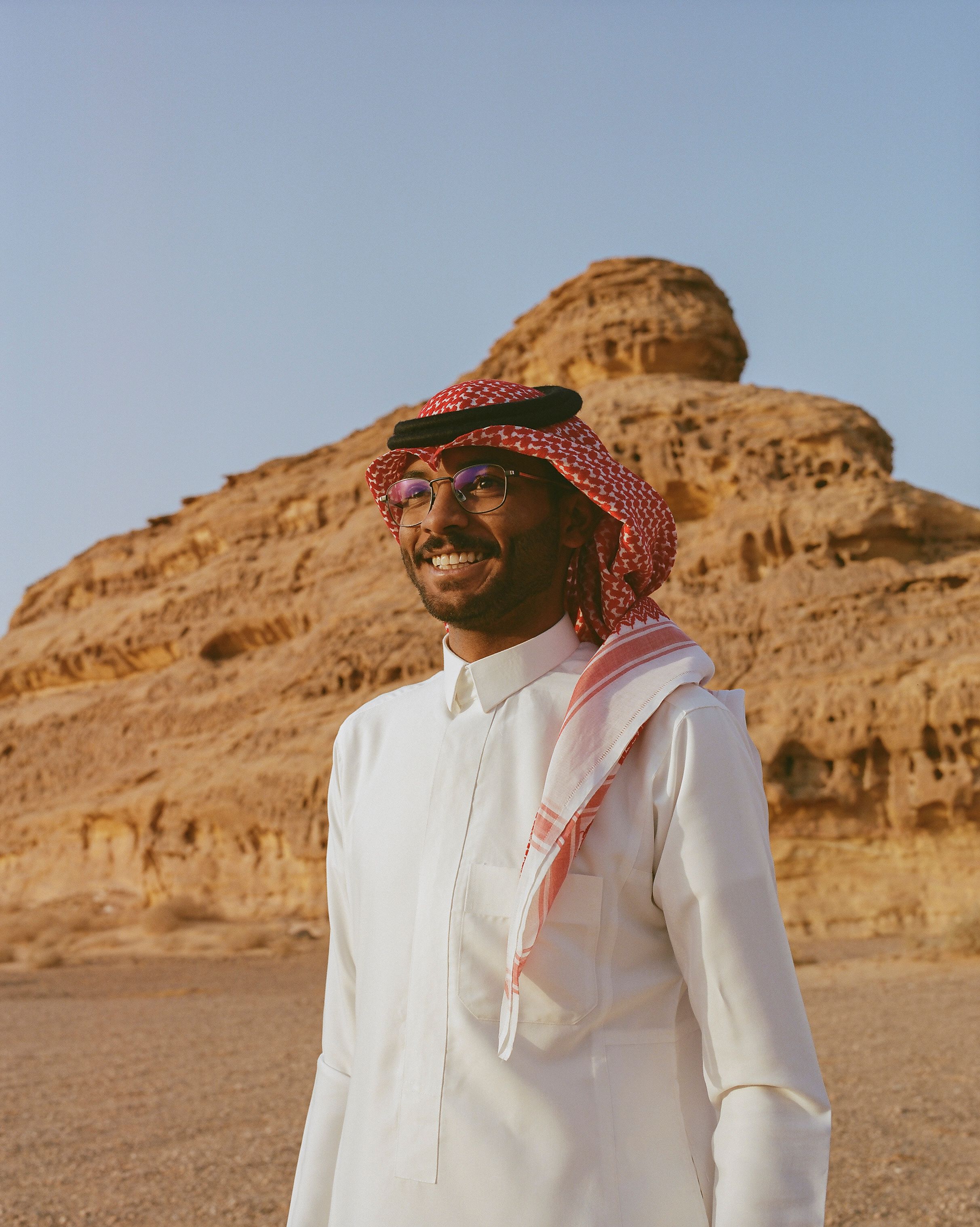 A shop keeper looks out of his shop at the market [Photo courtesy of Holly-Marie Cato]