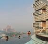 People swim in the infinity pool and look out over the city at Atlantis The Royal hotel in Dubai