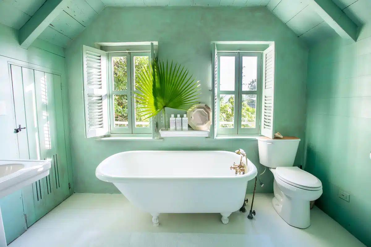 The seafoam-green bathroom, with roll top bath