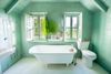 The seafoam-green bathroom, with roll top bath