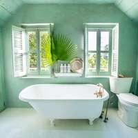 The seafoam-green bathroom, with roll top bath