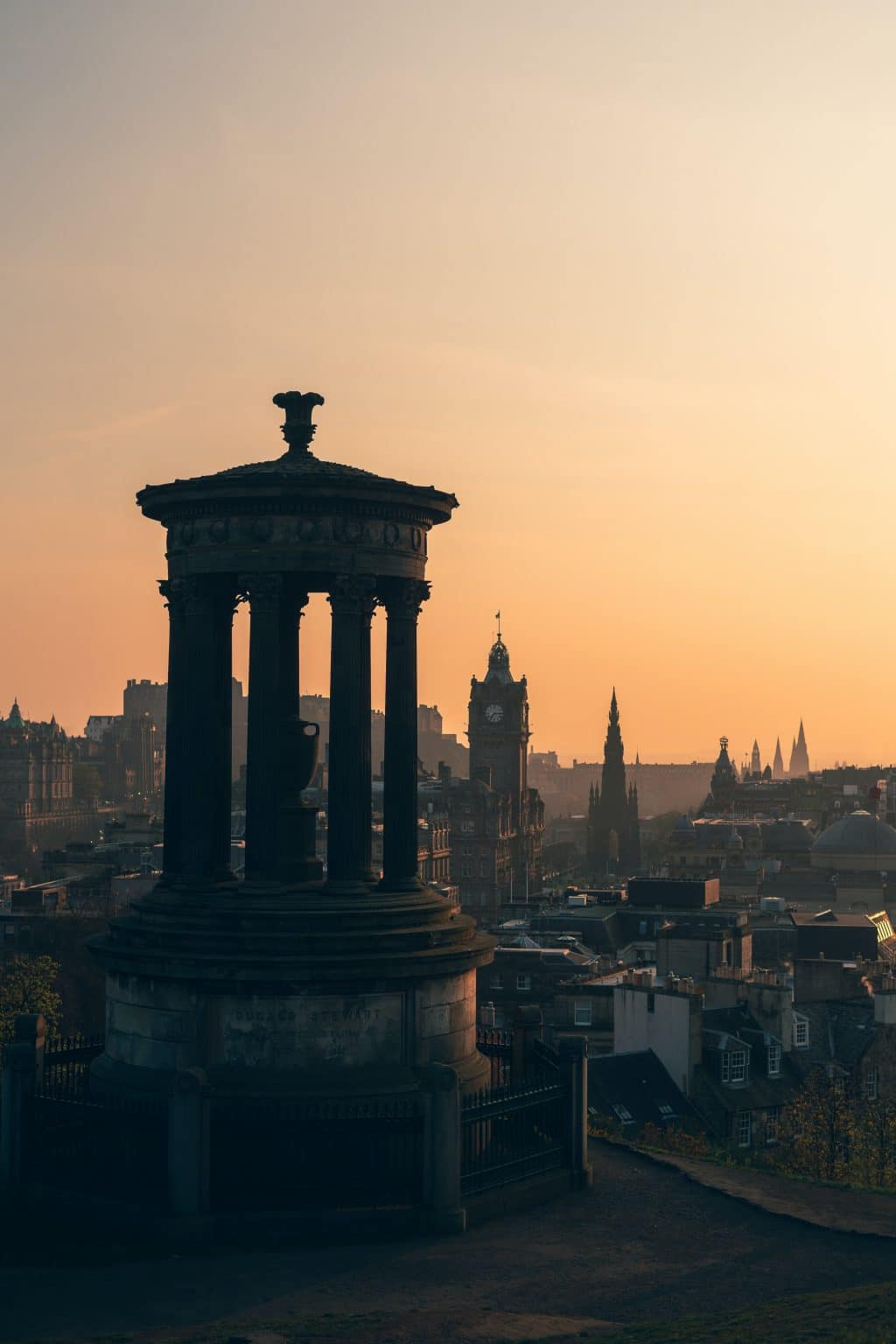 Edinburgh's Calton Hill, seen at sunset, with the spires of the city beyond
