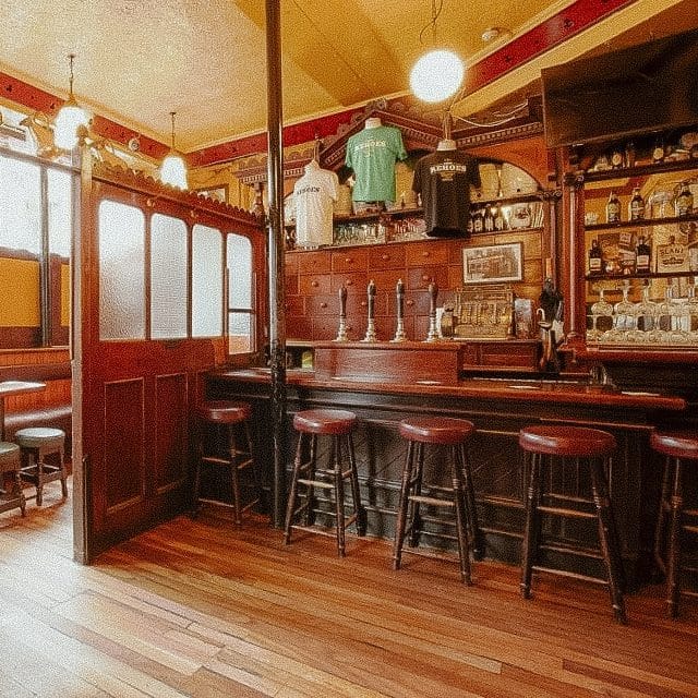 Stools line the bar of traditional pub Kehoes in Dublin, Ireland