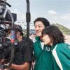 Actors from Netflix's Squid Game check the camera in a behind-the-scenes shot