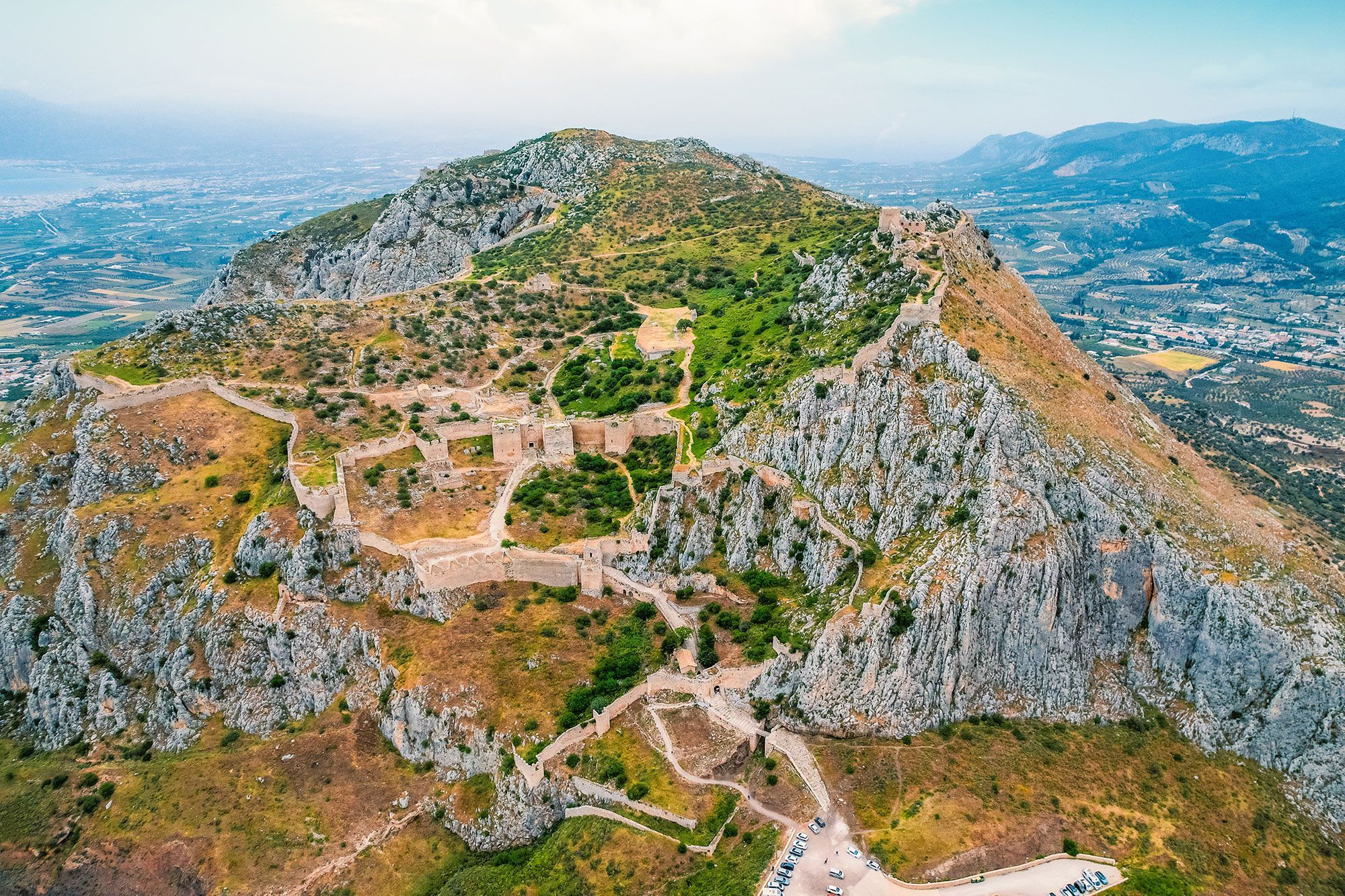 The Acrocorinth fortress sitting on a mountain in Greece.