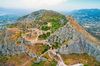 The Acrocorinth fortress sitting on a mountain in Greece.