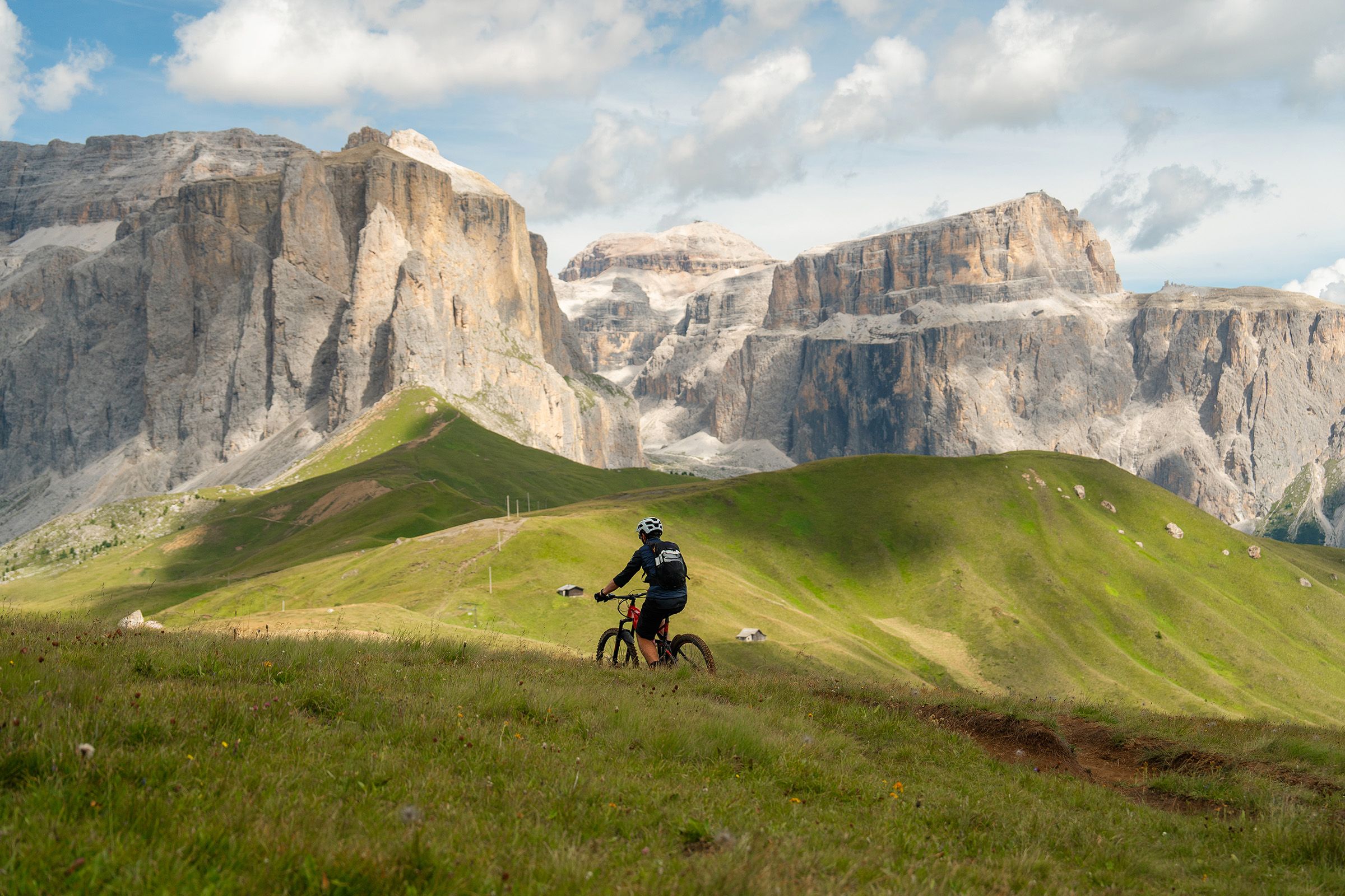 biker with Dolomites in the background